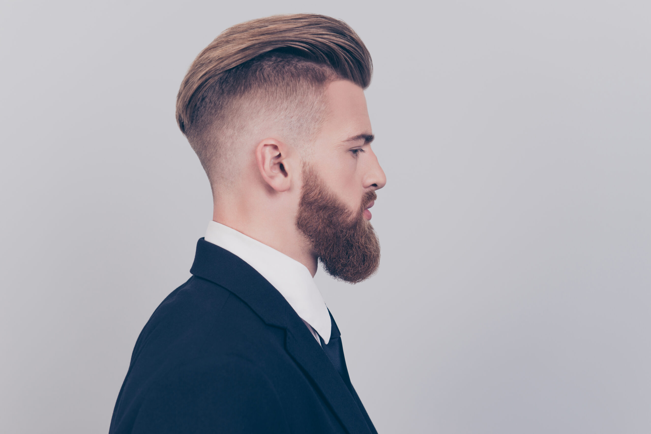 Unleash Your Confidence: Sharp Fades and Tailored Beard Trims for Busy Professionals